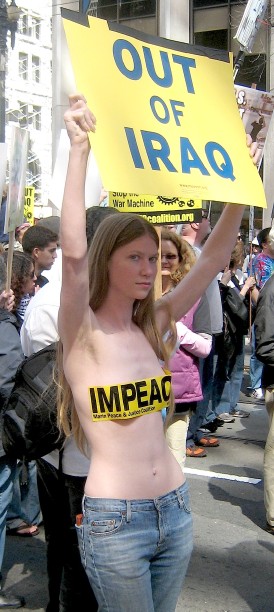 pretty anti-war protester with tape on her boobs