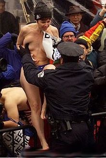 nude protester arrested by police