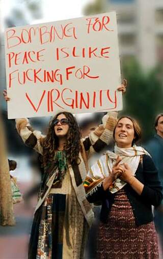 Earnest counter-culture women with fucking-for-virginity protest sign