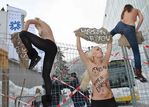 FEMEN nude protestes climbing crowd control fences in Davos