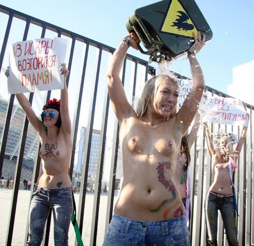 FEMEN activists pretend to splash gasoline on themselves