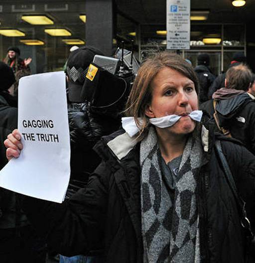 gagged wikileaks protester