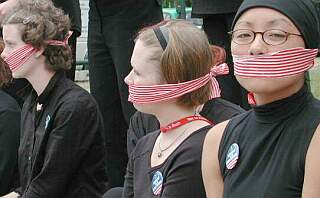 green peace girls with gagged mouths