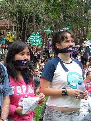 cute female war protesters wearing mouth gags