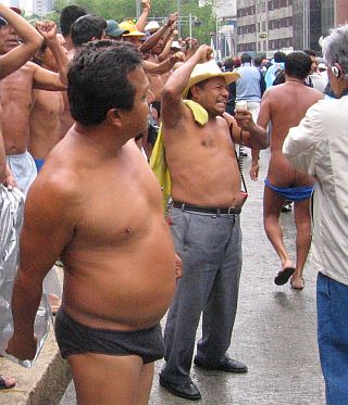 semi-nude men protesting in Mexico