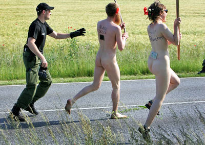 naked protesters flee the cops