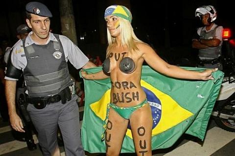 half naked protester against bush in brazil