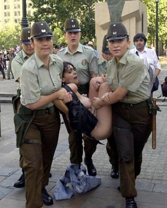 nude protester being carried by policewomen