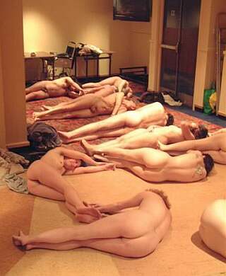 naked protesters rehearsing indoors