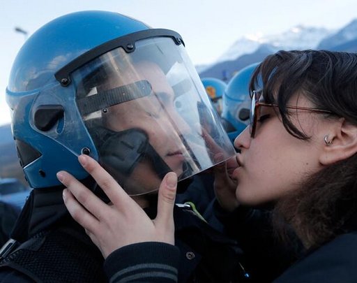 protester kisses a riot cop